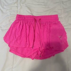 Neon pink, running shorts, size small, good condition